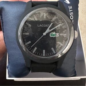 Lacoste new watch. Black band. Never worn sticker on face.